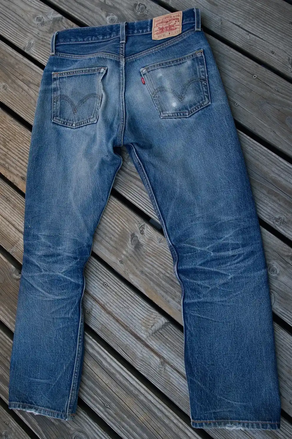 A pair of Levi's raw jeans.
